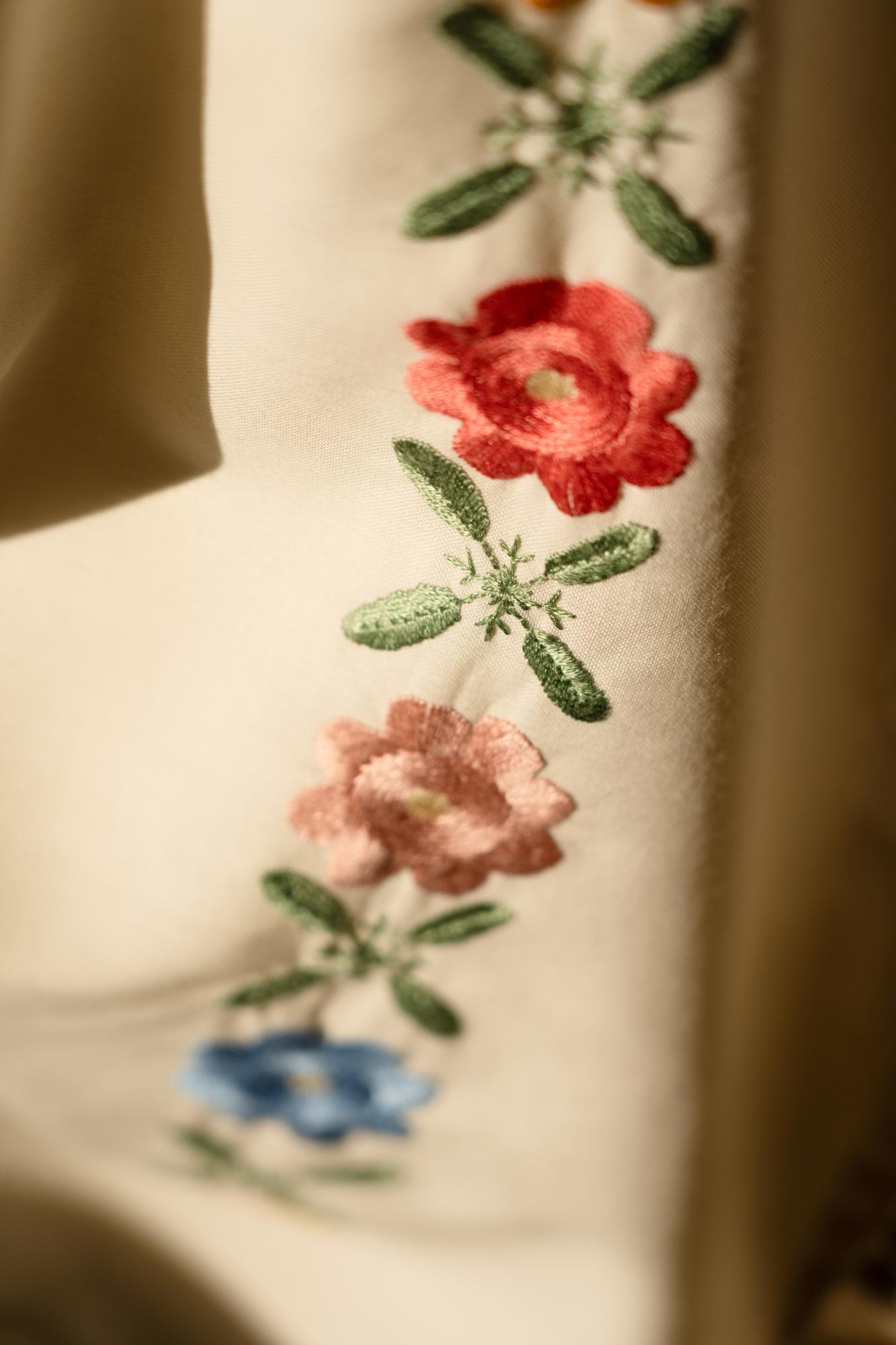 Close-up of hand embroidery on linen